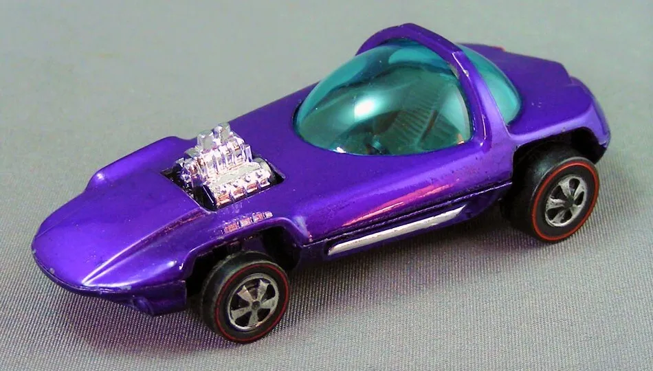 A purple die-cast toy car with a transparent cockpit and an engine detail on the hood.