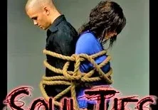 Two people tied back-to-back with a rope under the caption "soulties.