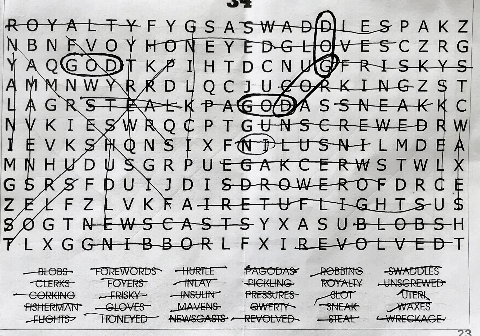 A partially completed word search puzzle with various circled and crossed-out words.