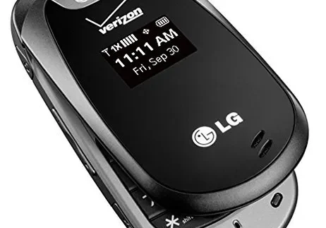 Black lg flip phone displaying the time and date on its external screen.