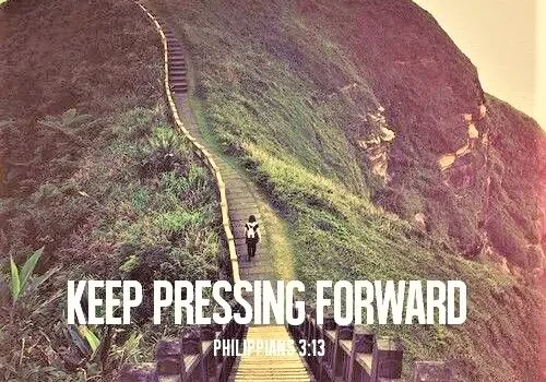 A person walks up a steep pathway towards a hilltop, accompanied by an inspirational quote "keep pressing forward - philippians 3:13".