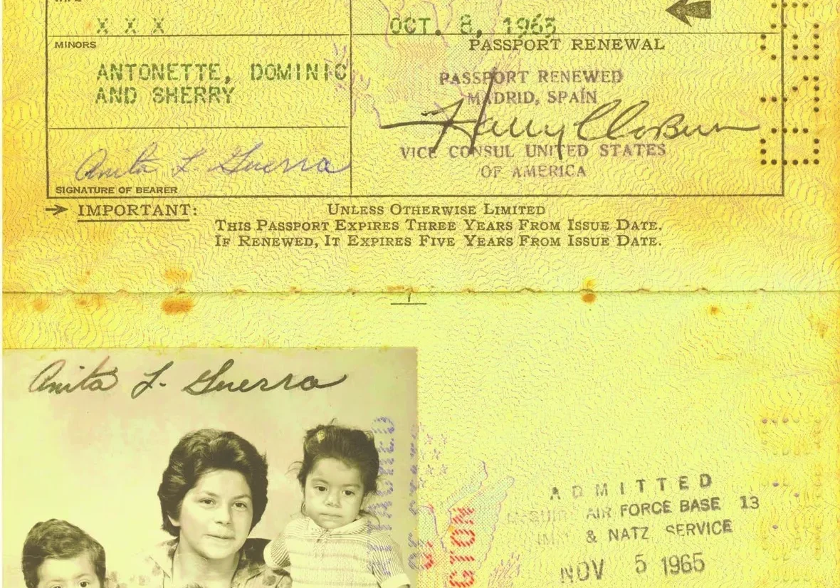 An old, faded passport with a renewal stamp and a black-and-white photograph of a woman with two young children.