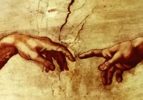 Detail of two hands reaching towards each other with fingers almost touching, from a famous renaissance fresco.