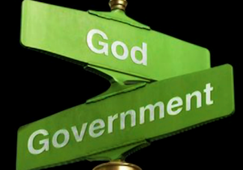 Green street signs with the words "god" and "government" displayed in a crossroad sign format against a black background.